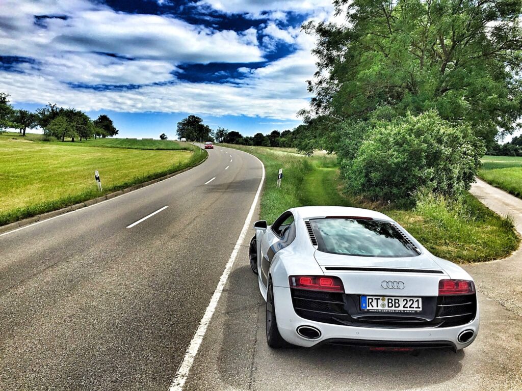 Elegant Audi R8 V10 Parked by Lush Countryside - Stunning Wallpaper