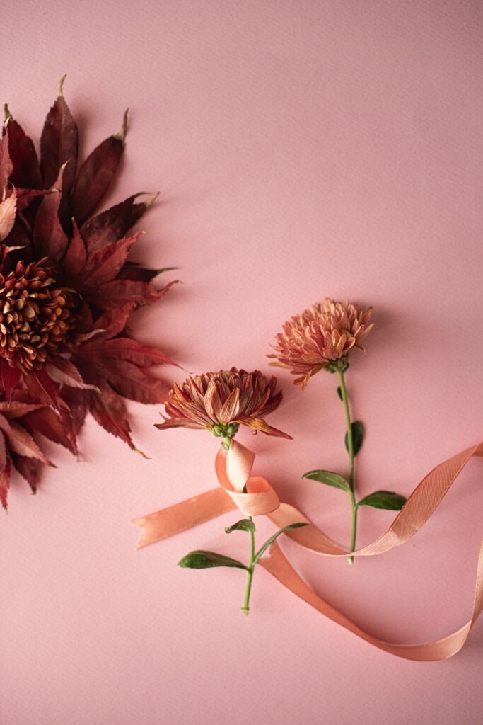 Elegant Autumn Flower Wallpaper with Soft Pink Background