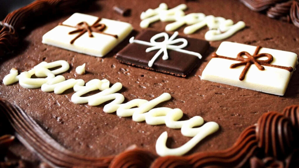 Elegant Chocolate Birthday Cake Wallpaper with Gift Box Icing