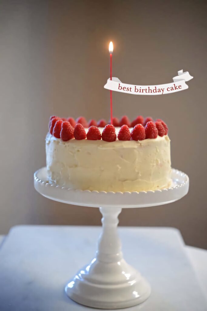 Elegant Birthday Cake with Raspberries & Candle on Stylish Stand Wallpaper