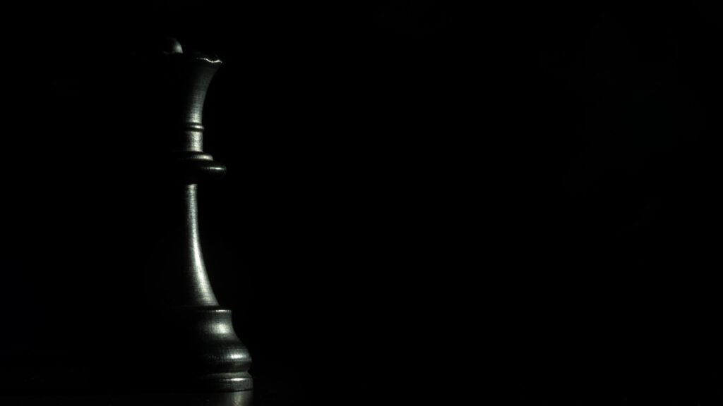 Elegant Black Chess Queen Wallpaper | Dramatic Minimalist Background