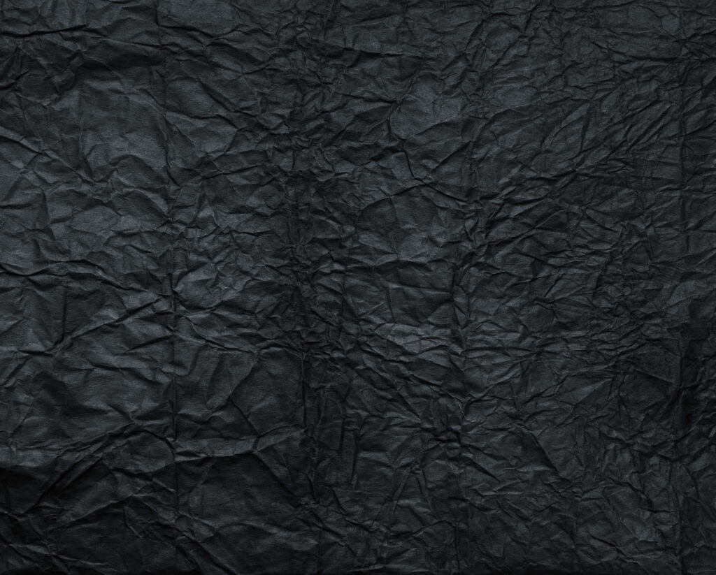 “Elegant Black Crumpled Paper Texture for Artistic Wallpaper Background”