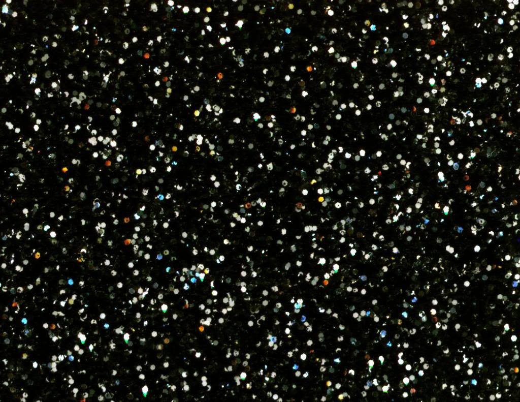 Elegant black glitter wallpaper with shimmering high contrast reflections and deep texture background