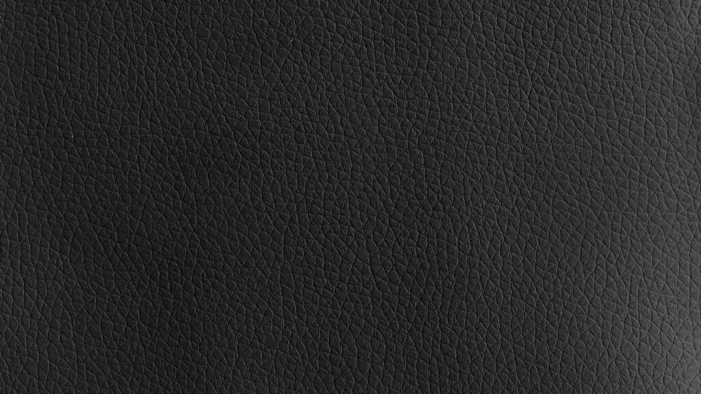 Modern Black Textured Leather Wallpaper Background for Minimalist Designs