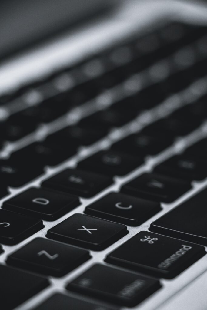 Elegant Black and White MacBook Keyboard Wallpaper Background