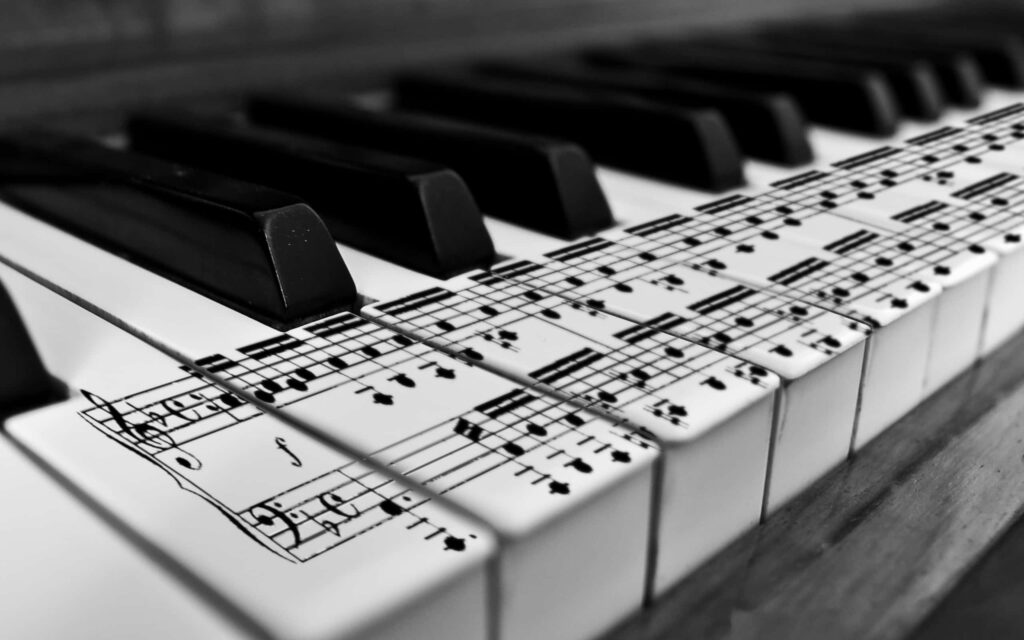 Black and White Piano Keyboard Wallpaper with Musical Notes Design