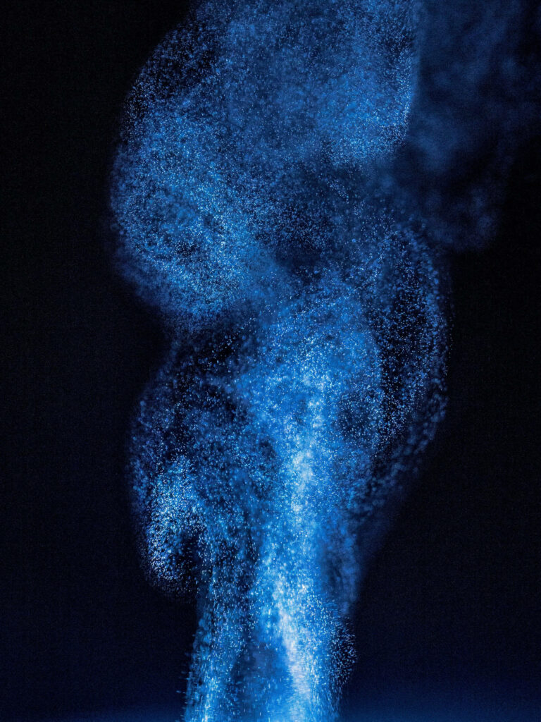 Elegant Blue Powder Abstract Wallpaper on Dark Background