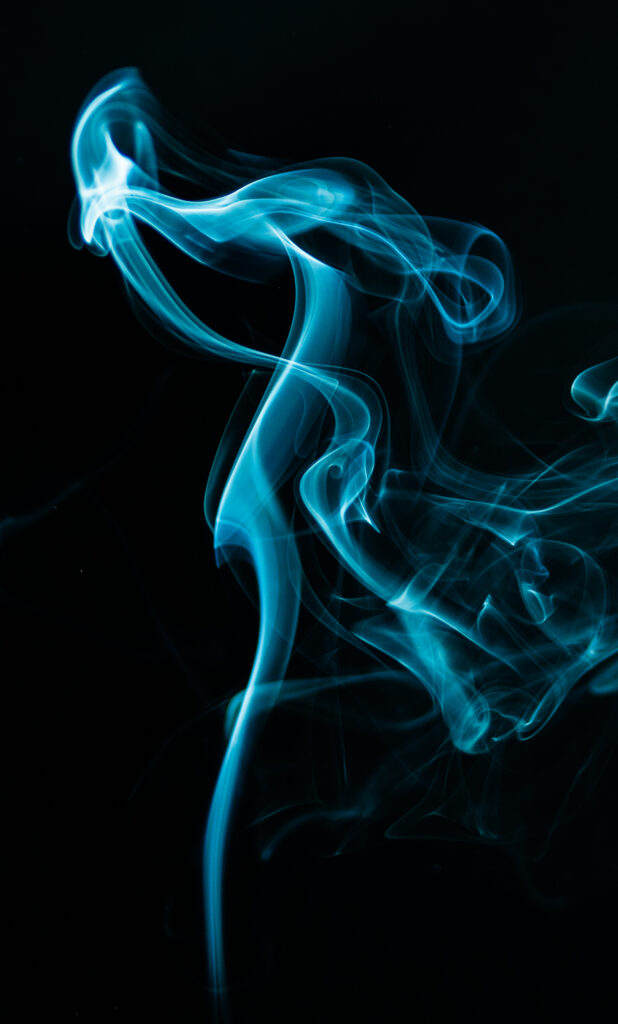 Ethereal Blue Smoke Wallpaper on Black Background - Mesmerizing Design