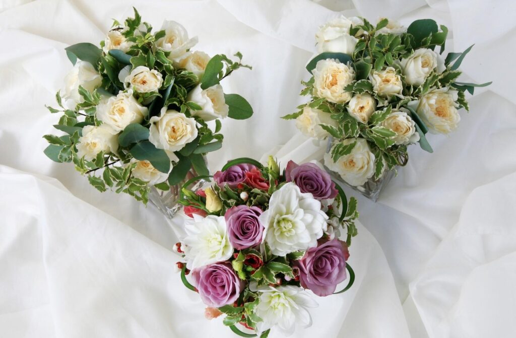 Elegant Bouquet Wallpaper: Roses & Dahlias on Soft Fabric Background