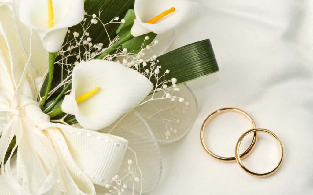 Elegant Bridal Bouquet & Gold Wedding Rings on Soft White Fabric Wallpaper