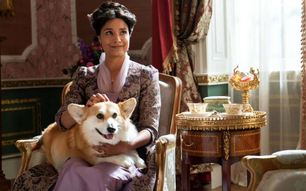 Elegant Bridgerton Scene: Character with Corgi in Stunning Wallpaper