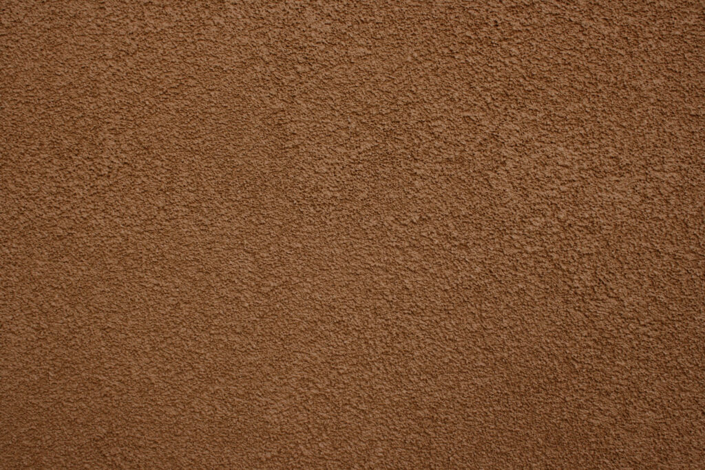 Rich Brown Textured Stucco Wall: Elegant Wallpaper Background