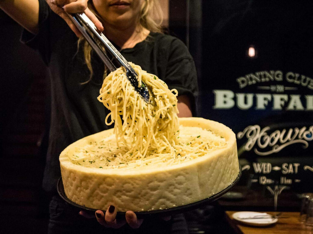 Cacio e Pepe Pasta Served from Parmesan Wheel - Creamy Wallpaper