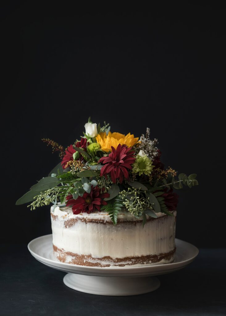 Elegant Cake Wallpaper: Vibrant Floral Decor for Sweet Ambiance