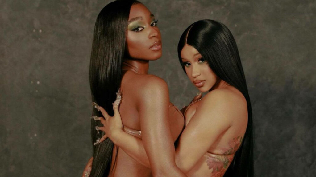 Elegant Wallpaper of Cardi B and Normani in Stylish Poses