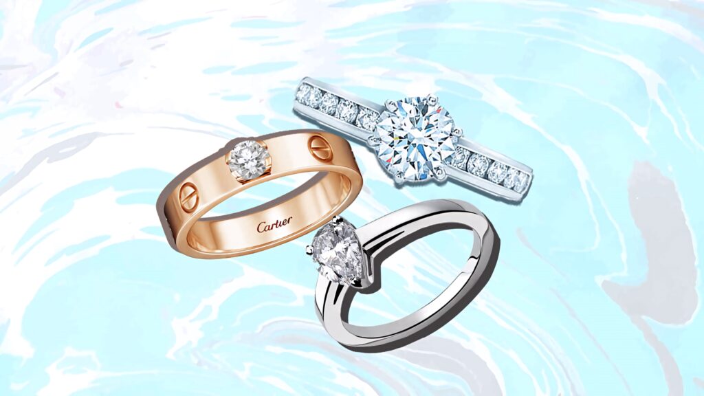 Cartier engagement rings with gold platinum diamonds on blue white marble background elegant design Wallpaper