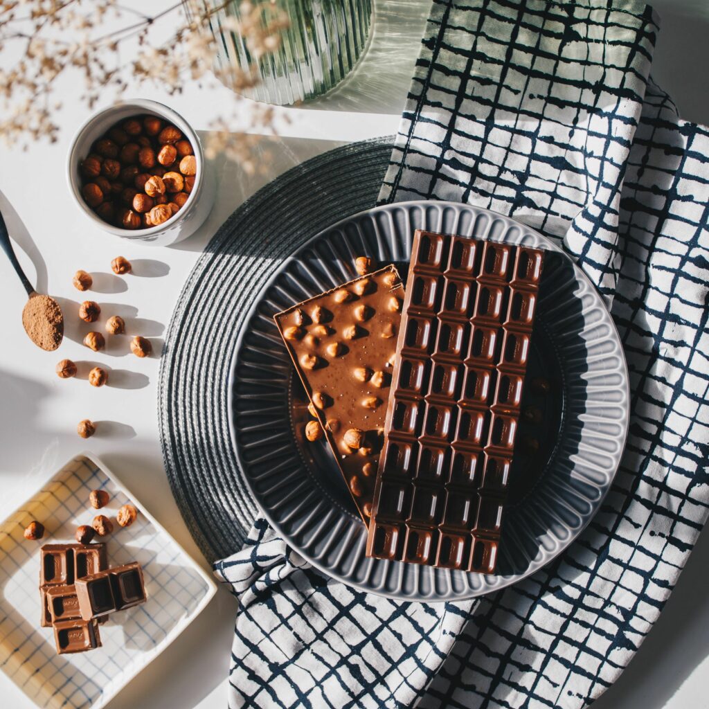 Elegant Chocolate Bar Display with Nuts | Delicious Dessert Wallpaper