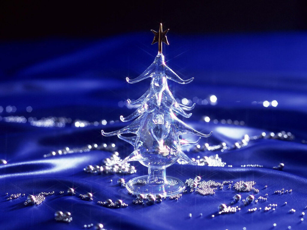 Elegant Glass Christmas Tree Wallpaper on Shimmering Blue Background