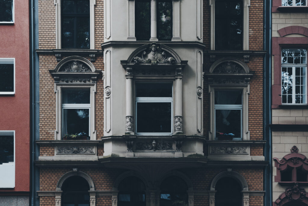 Elegant Classical Building Facade Wallpaper - Intricate Design Background