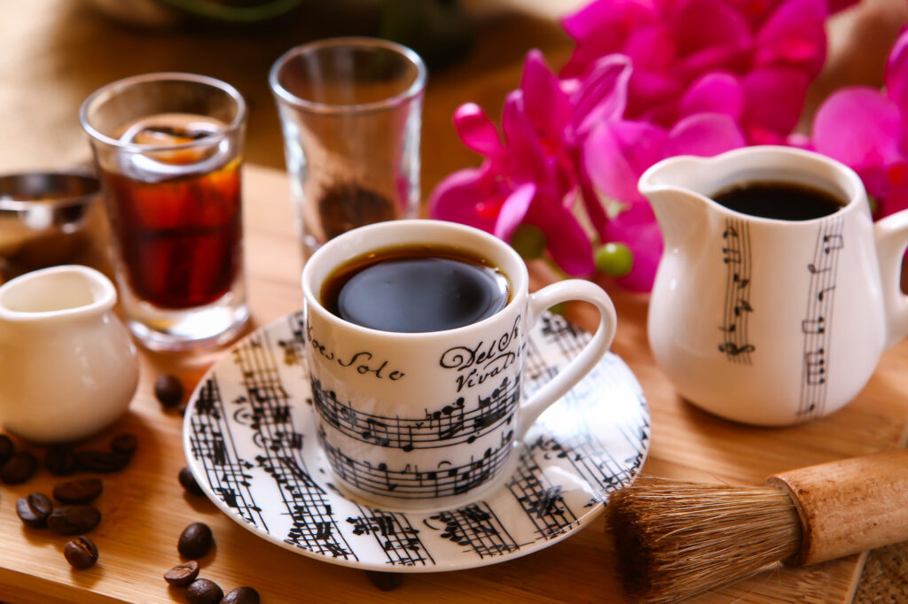 Elegant Coffee Scene with Musical Notes: Cozy Wallpaper Background