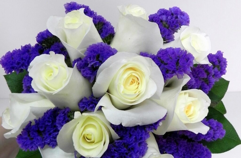 Elegant Cream and Purple Floral Wallpaper Background Design