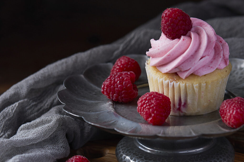 Elegant Cupcake with Raspberry Frosting on Silver Plate Wallpaper