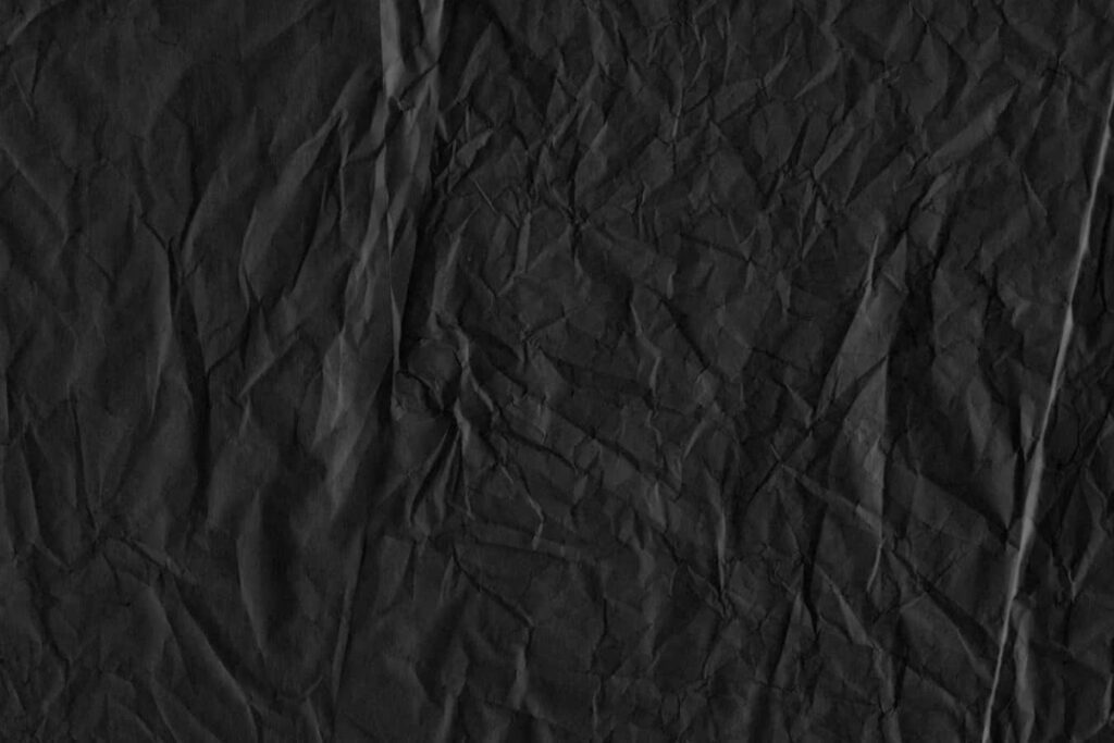 Elegant Dark Black Textured Wallpaper with Subtle Crumpled Patterns