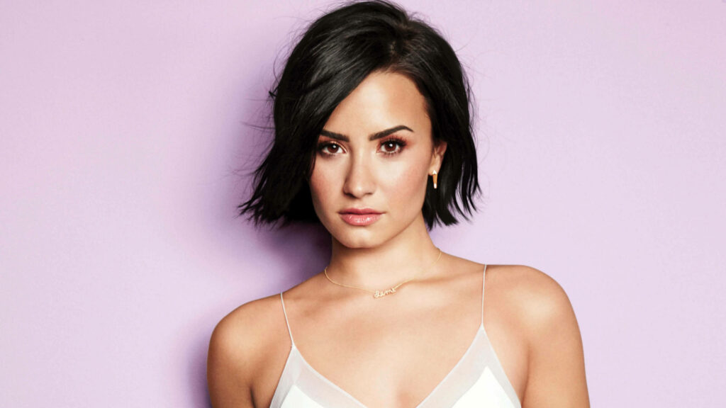Elegant Demi Lovato Wallpaper: Soft Lavender Background Style