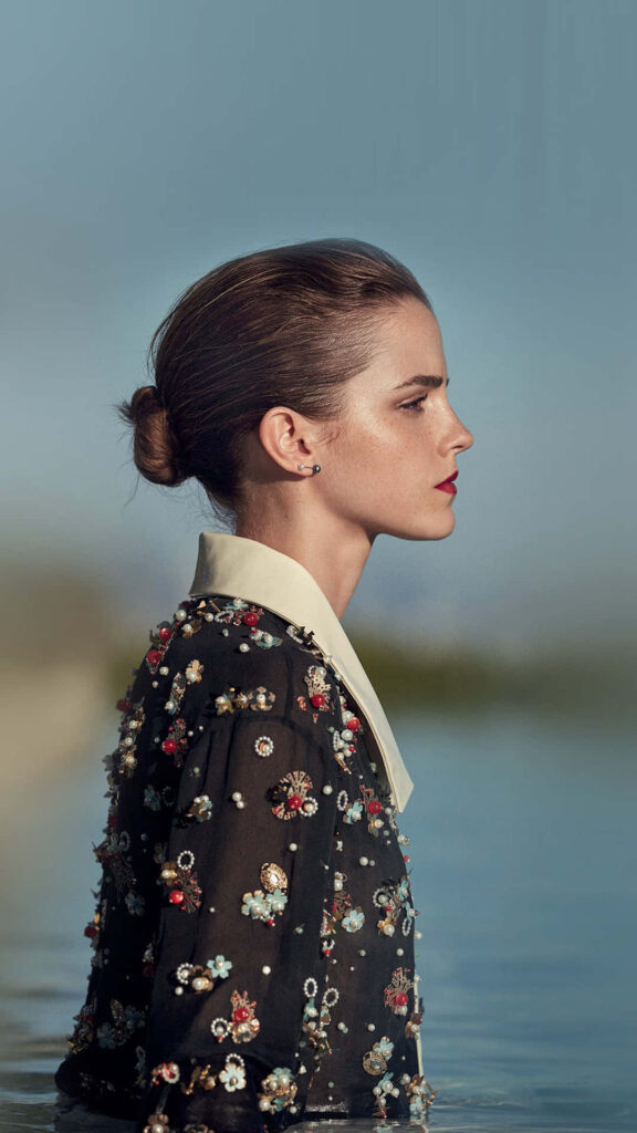 Elegant Emma Watson Side Profile Wallpaper with Floral Embellishments