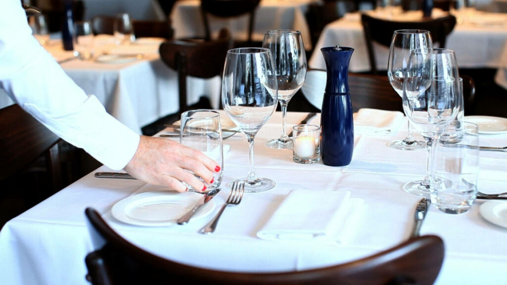 Elegant Fine Dining Table: Set with Cutlery & Candle Wallpaper