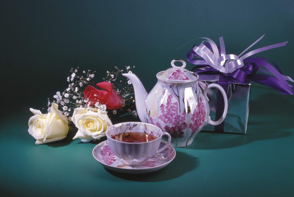 Elegant Floral Teapot Still Life with Roses & Gift Box Wallpaper