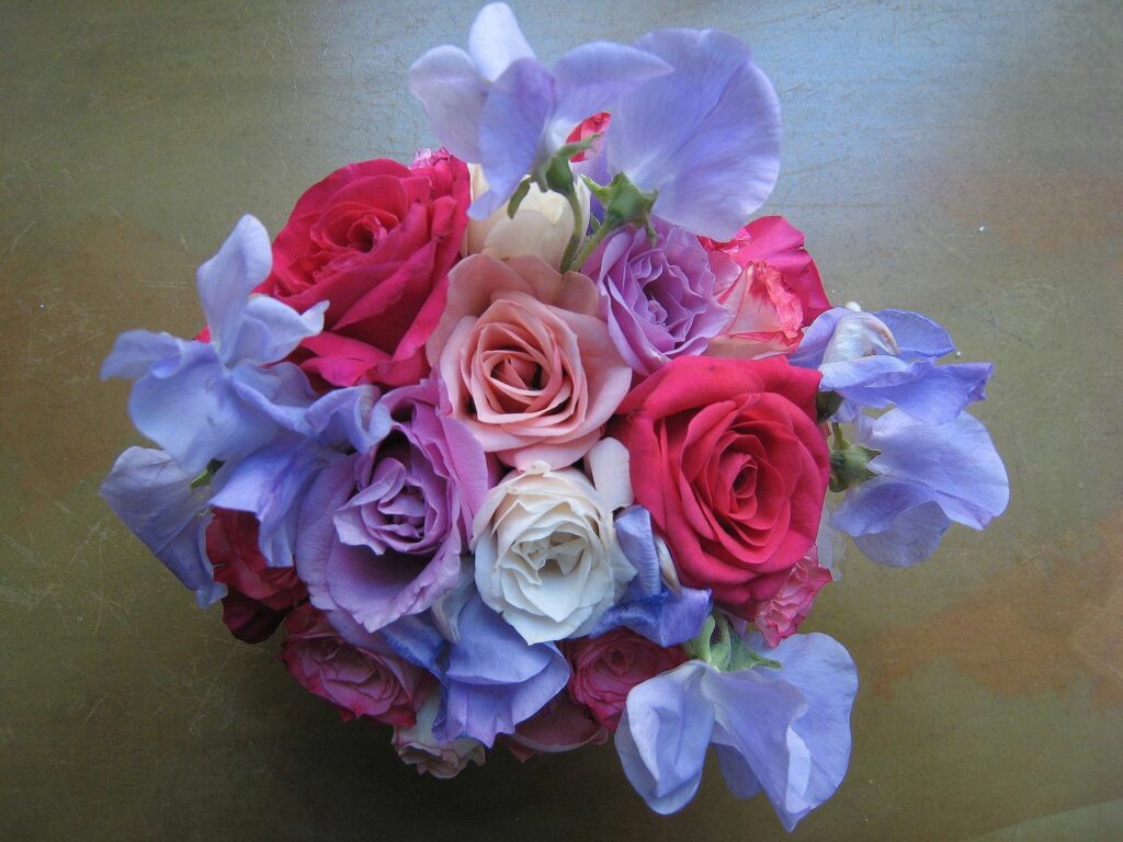 Elegant Pink and Red Rose Bouquet in Serene Setting Wallpaper