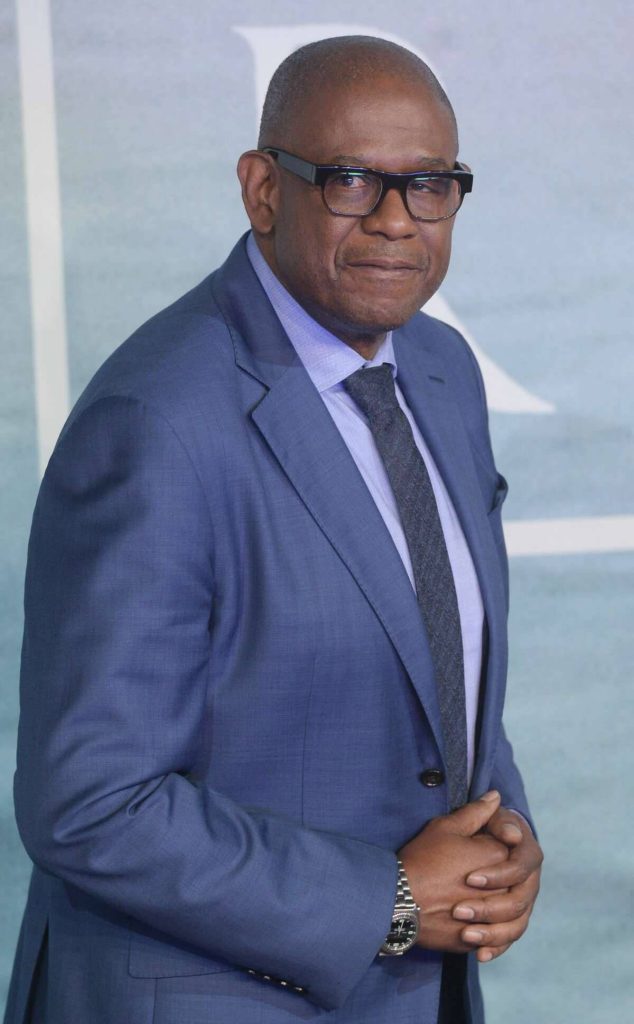 Forest Whitaker in sharp blue suit glasses calm professional portrait wallpaper background