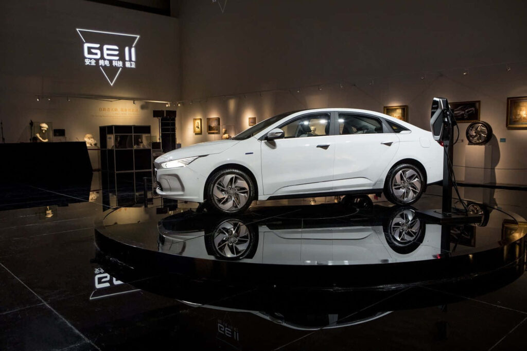 Elegant Geely Car Wallpaper: Modern Design in Showroom Setting