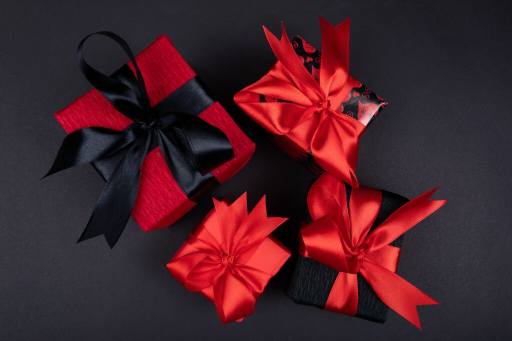 Elegant Gift Boxes with Red and Black Ribbons - Stylish Wallpaper