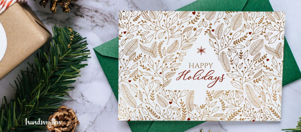 Elegant Gold Christmas Tree Card with Green Leaves on White Background Wallpaper