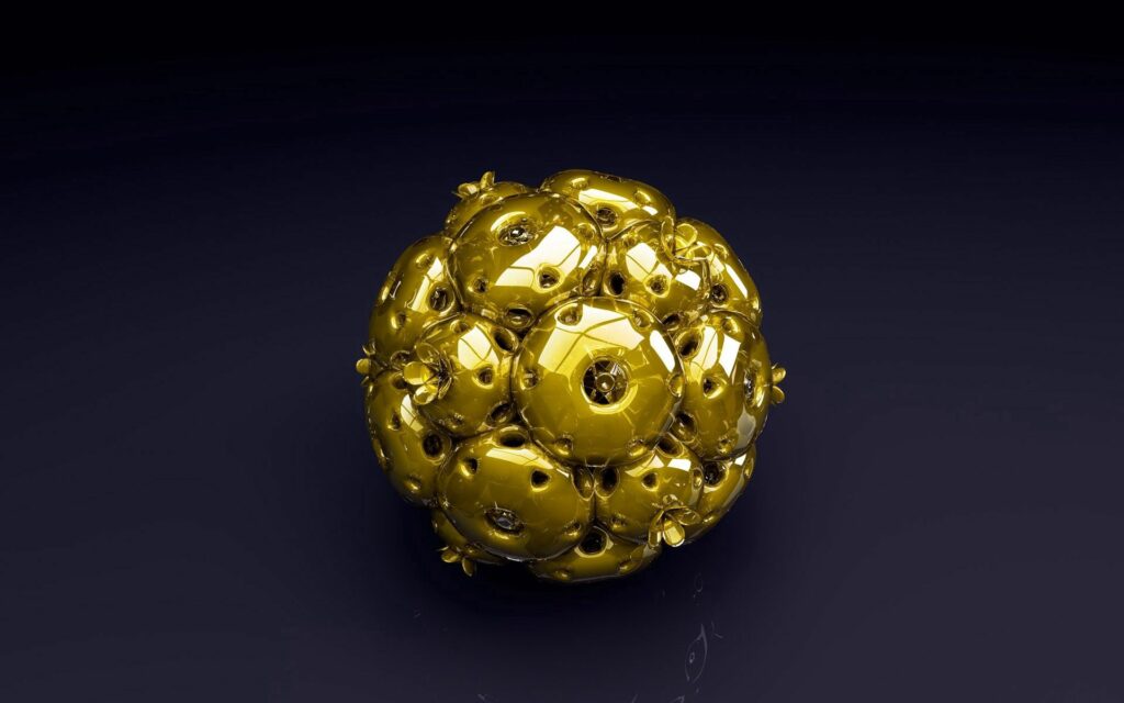 Luxurious Metallic Gold Sphere Wallpaper on Dark Background