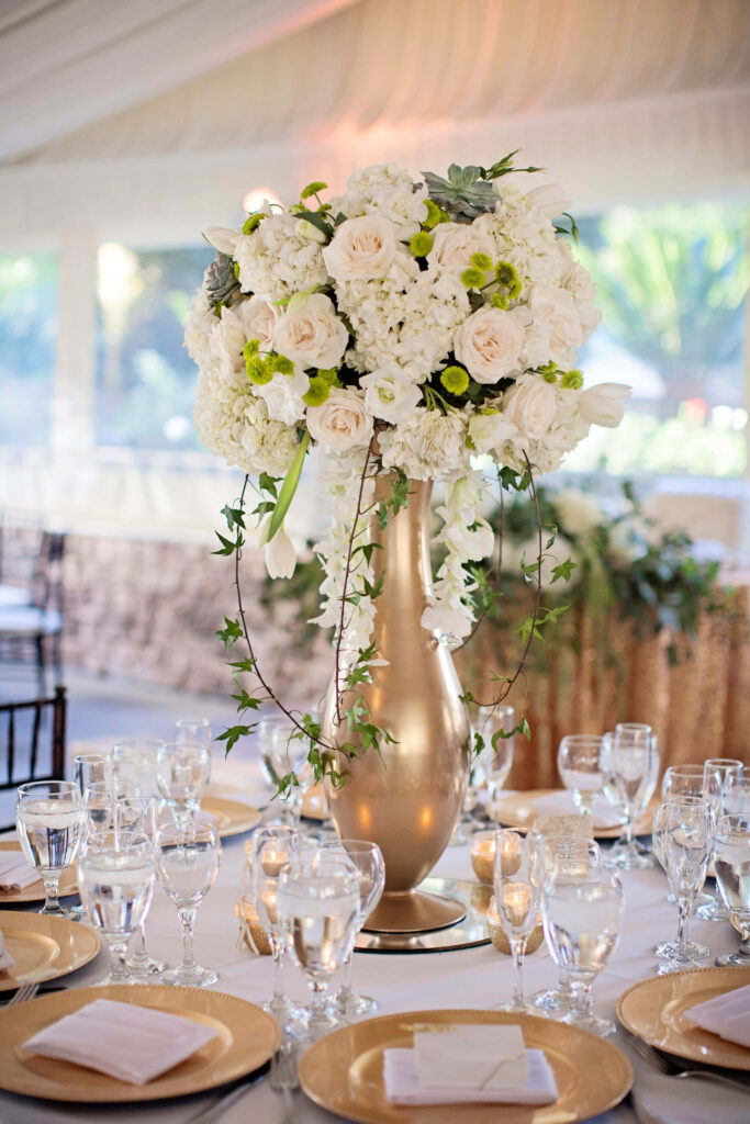 Elegant centerpiece wallpaper with tall gold vase white roses hydrangeas greenery candles