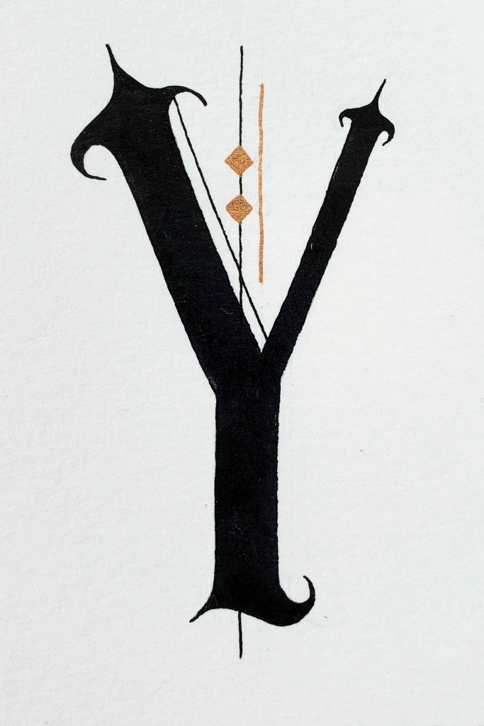 Classic gothic letter Y wallpaper with black font and copper geometric accents on white background