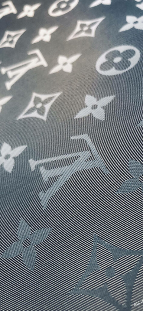 Louis Vuitton monogram wallpaper in gray and white tones for a luxury phone background