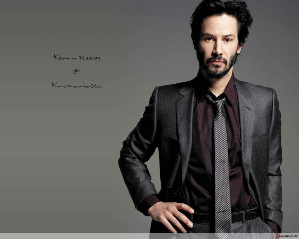 Elegant Keanu Reeves Wallpaper: Charismatic Suit for Branding Visuals