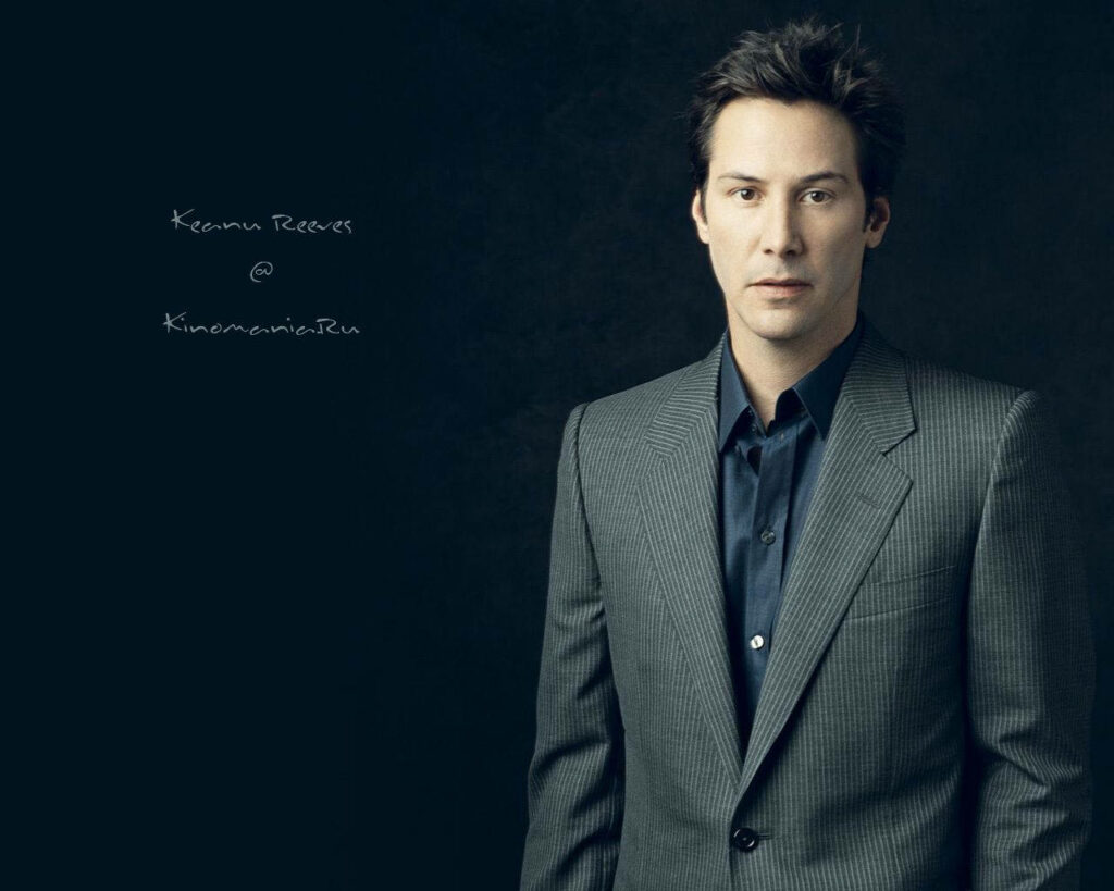 Elegant Keanu Reeves in Formal Suit Wallpaper - Poised & Charismatic