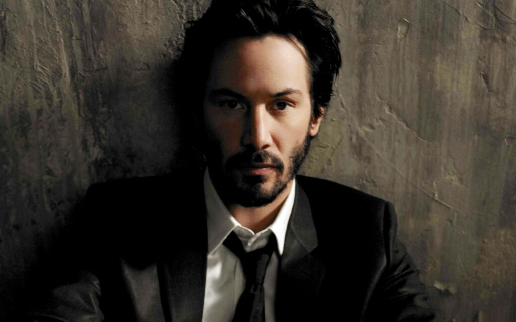 Elegant Keanu Reeves in Suit Wallpaper - Charismatic Background Design