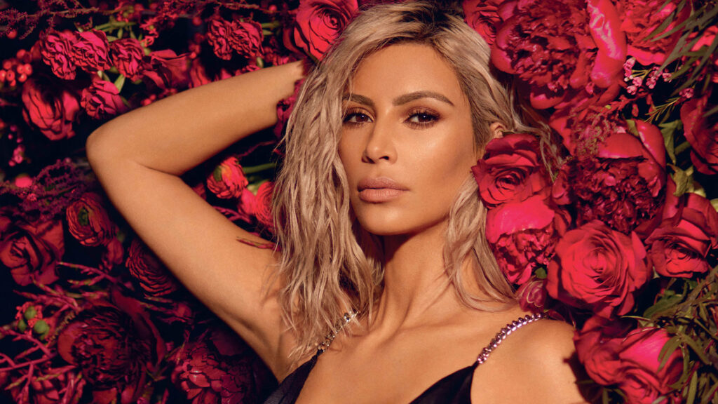 Elegant Kim Kardashian Wallpaper with Red Rose Bouquet