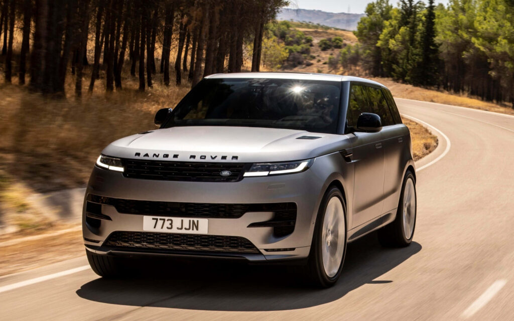 Elegant Land Rover Evoque Wallpaper: Scenic Drive in Nature
