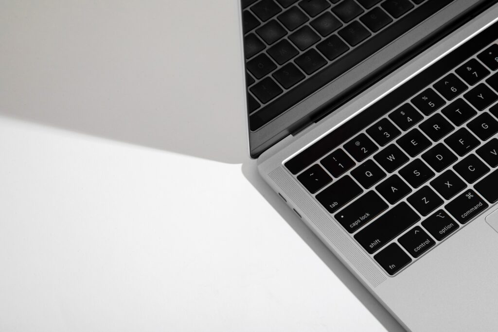 Elegant MacBook Wallpaper: Sleek Minimalist Design on White Background