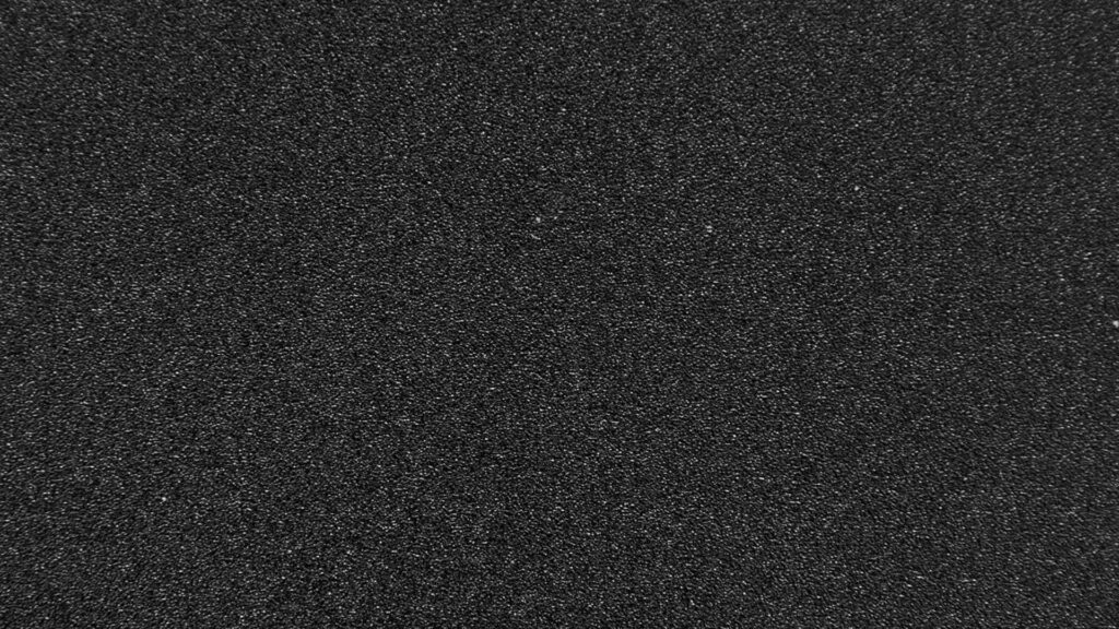 Elegant Black Textured Wallpaper: Minimalist Fine-Grain Design