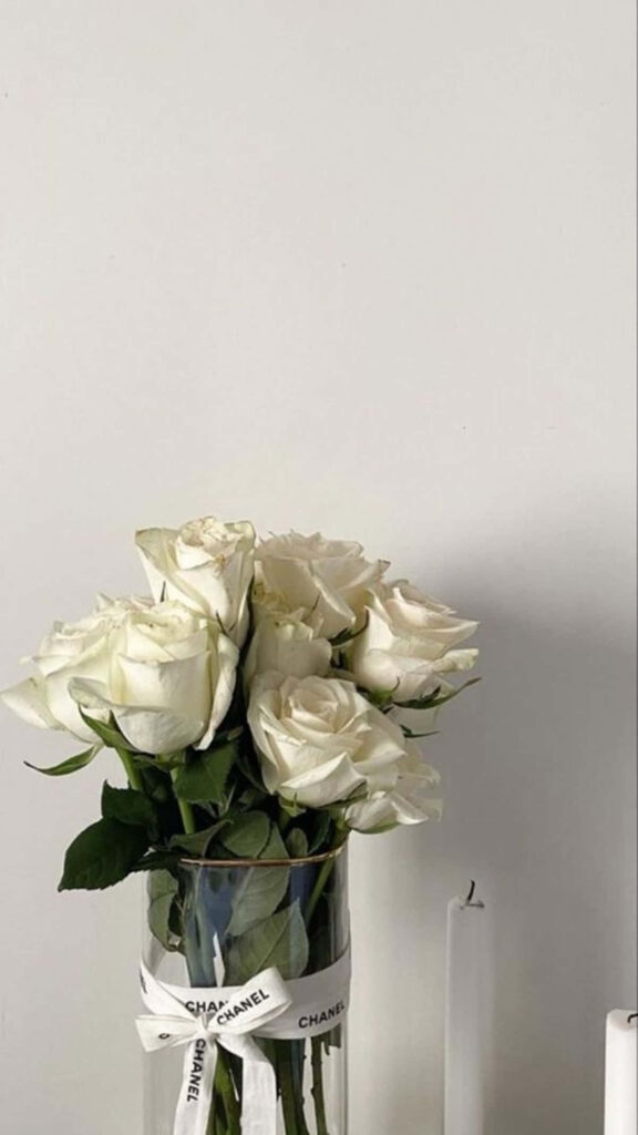 Minimalist White Roses in Chanel Vase - Elegant Wallpaper Design