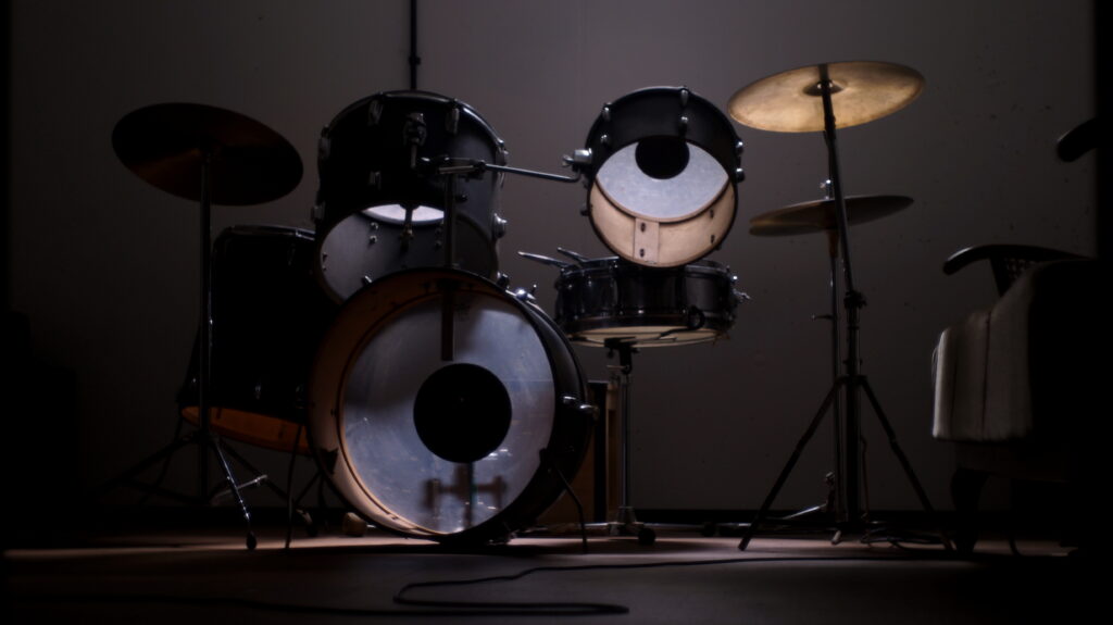 Elegant Minimalistic Drum Kit Wallpaper: Artistic Percussion Background