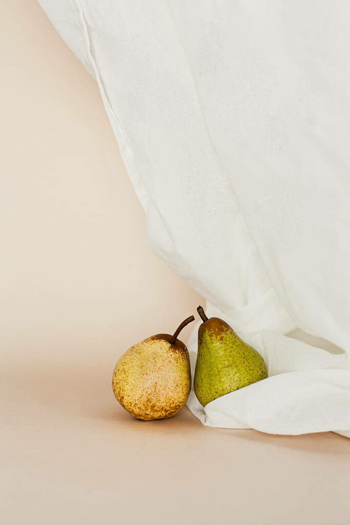 Serene Minimalist Wallpaper: Two Pears on Neutral Background